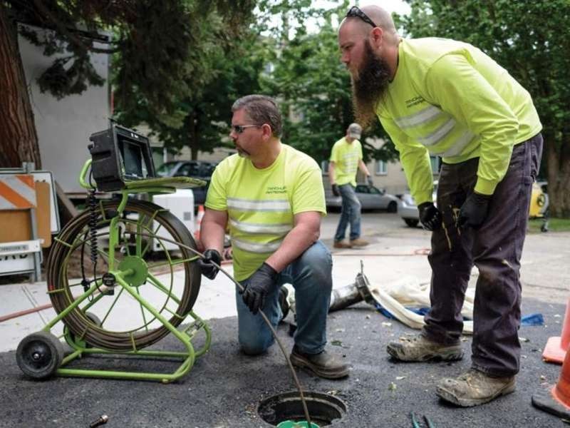 cme sewer repair technicians performing a sewer line camera inspection.